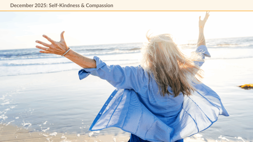 Woman facing a sunrise over a calm sea with arms joyfully reaching towards the sky