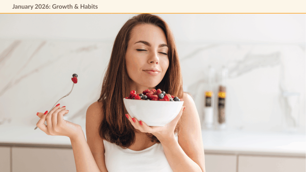 Calm and content woman eating a bowl of health fruits full-filling her new year resolution.